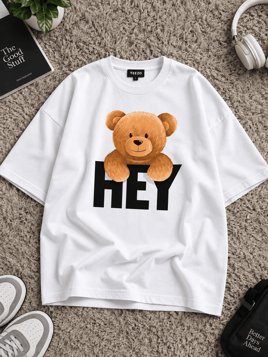 White HEY teddy bear oversized graphic T-shirt on rug
