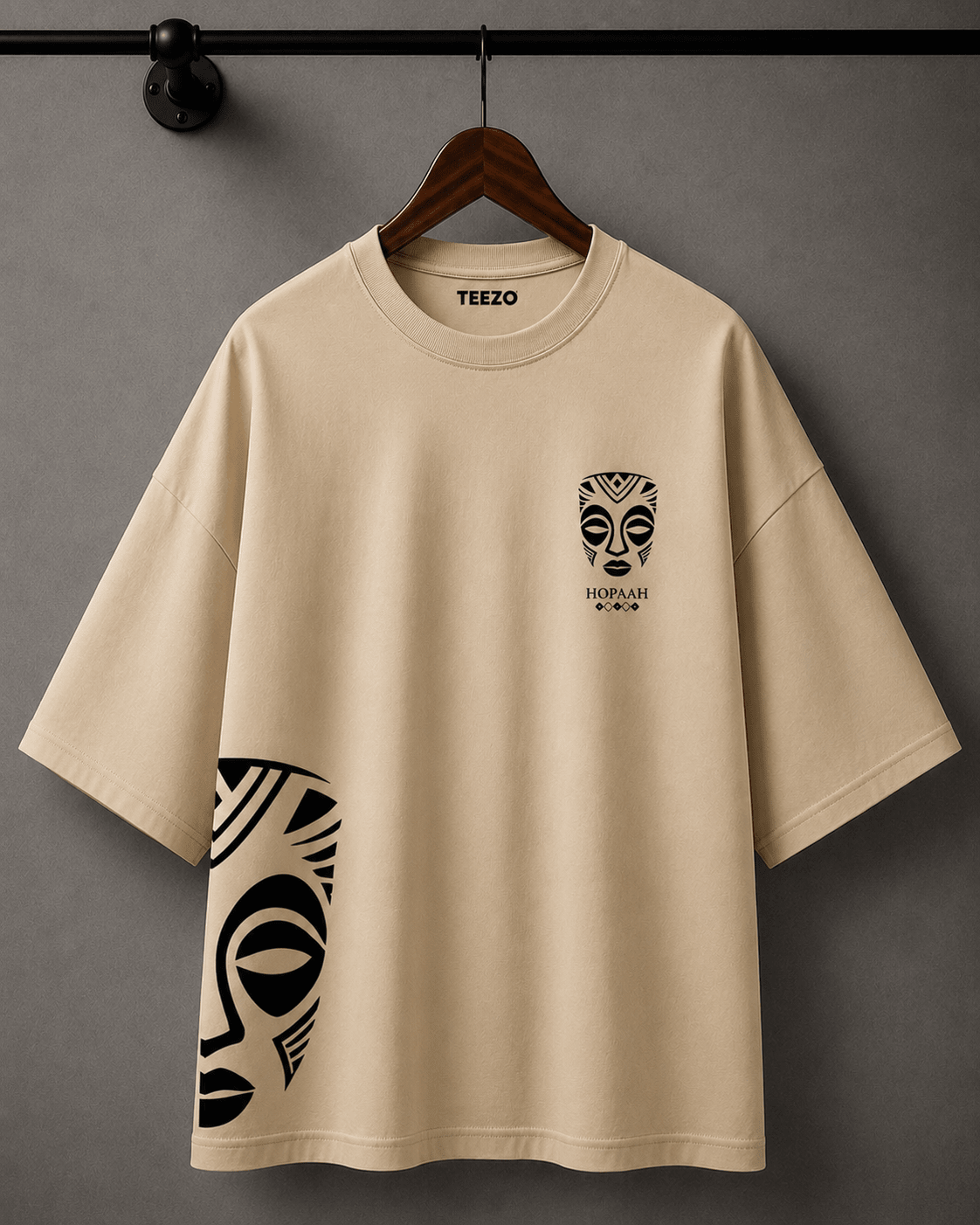 Premium oversized cotton T-shirt featuring a black and white tribal mask graphic for unisex streetwear.