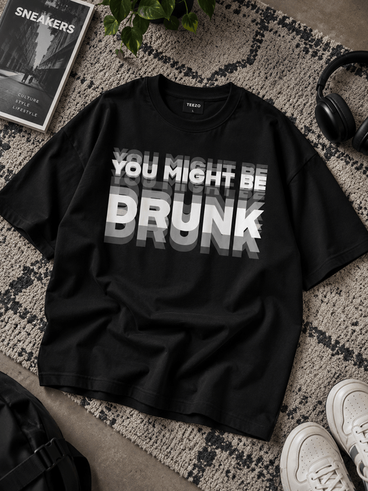 TEEZO You Might Be Drunk black oversized drop shoulder T-shirt on rug