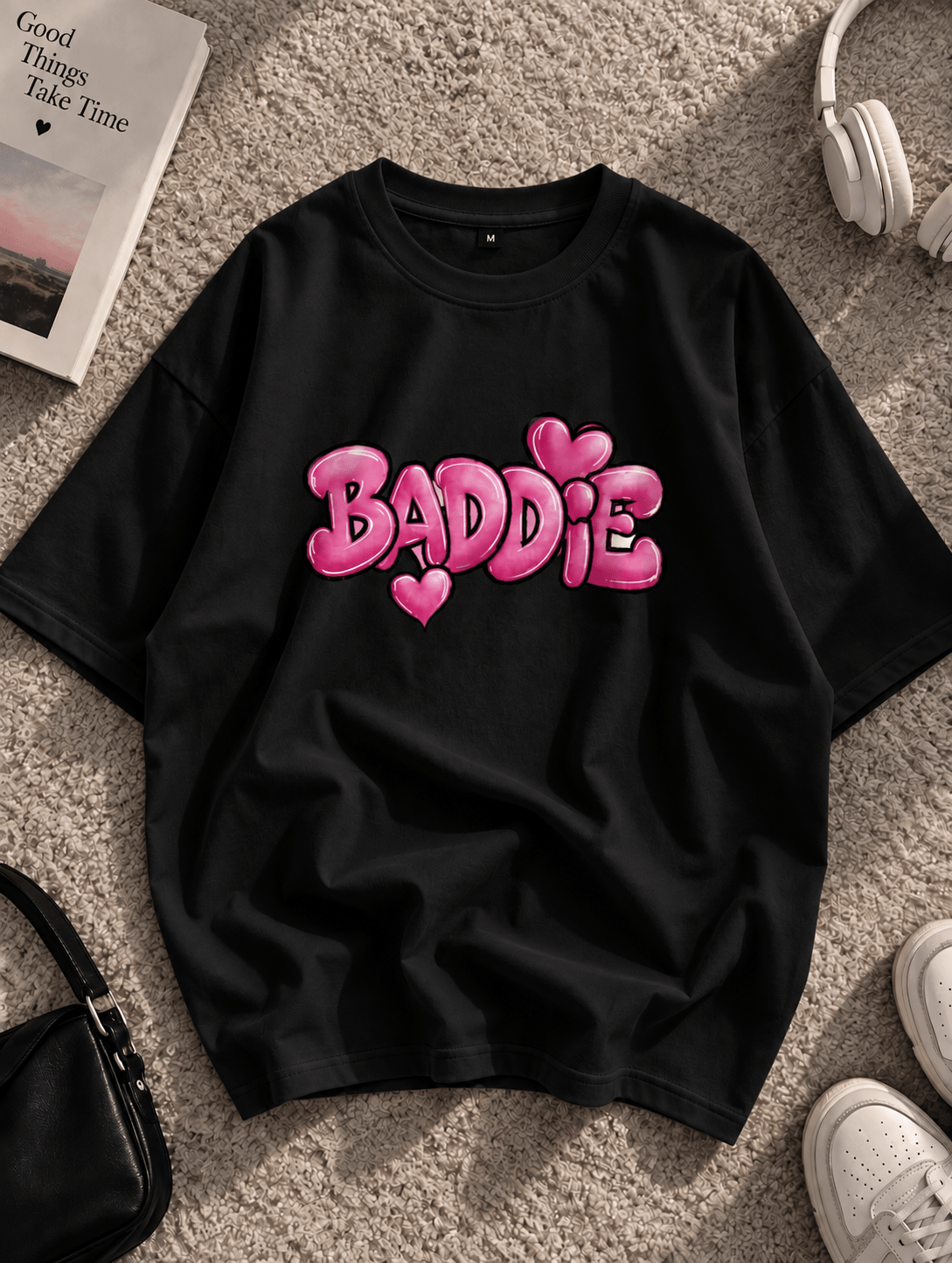 Black oversized BADDIE graphic T-shirt with pink bubble lettering