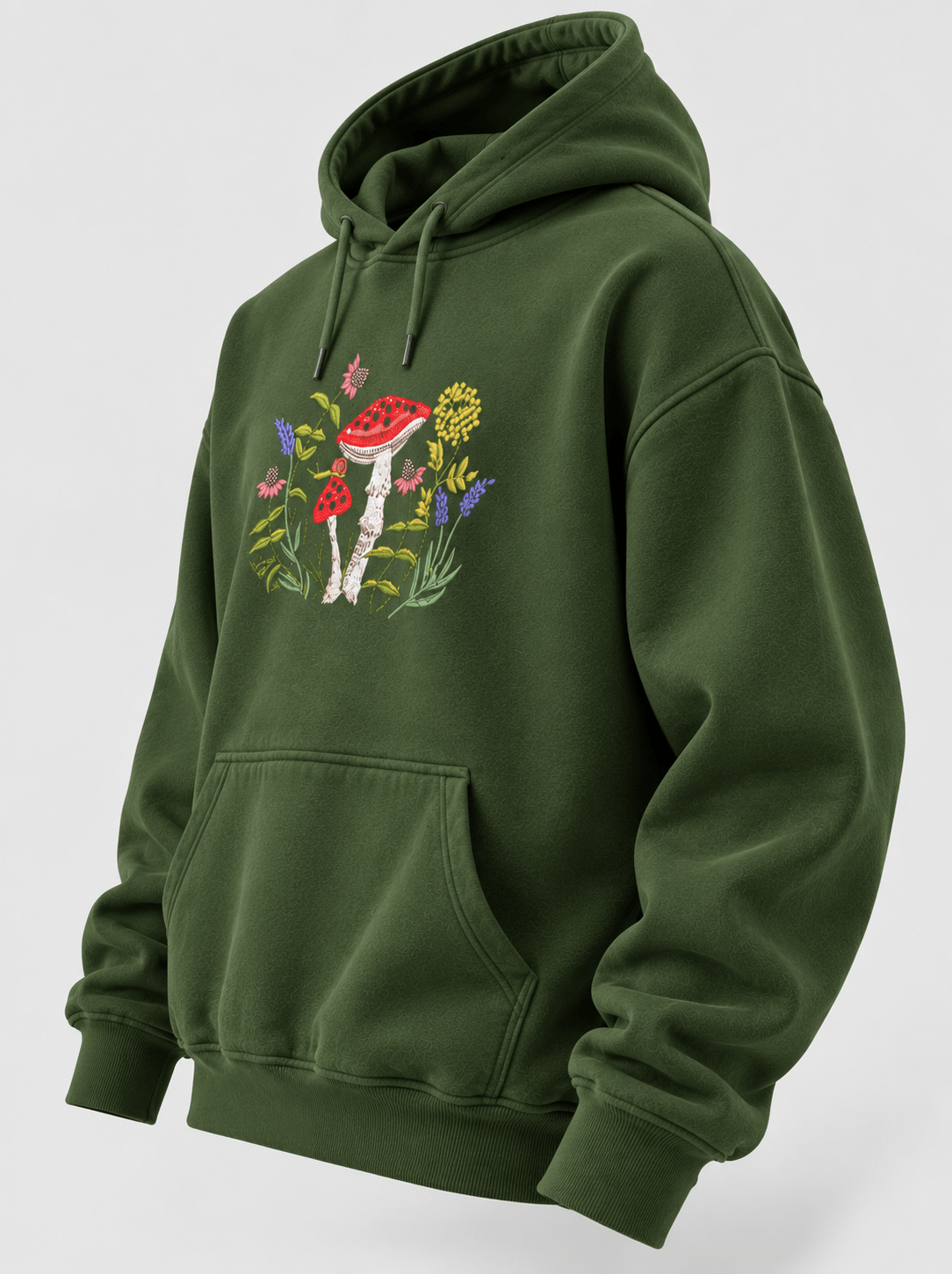 TEEZO forest green oversized hoodie featuring a colorful mushroom and floral garden graphic on the front