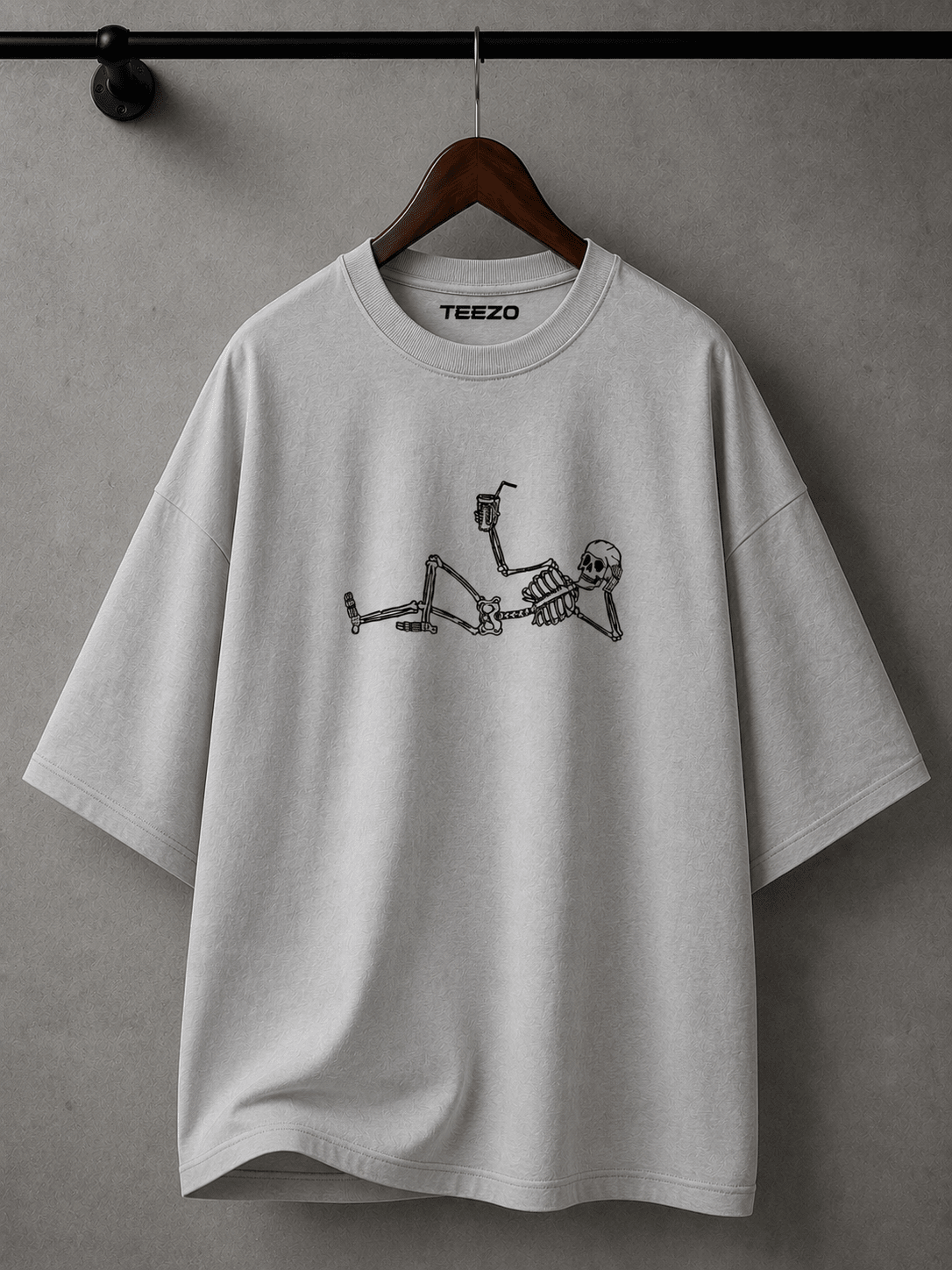 White oversized cotton T-shirt featuring a relaxed skeleton graphic for unisex streetwear.