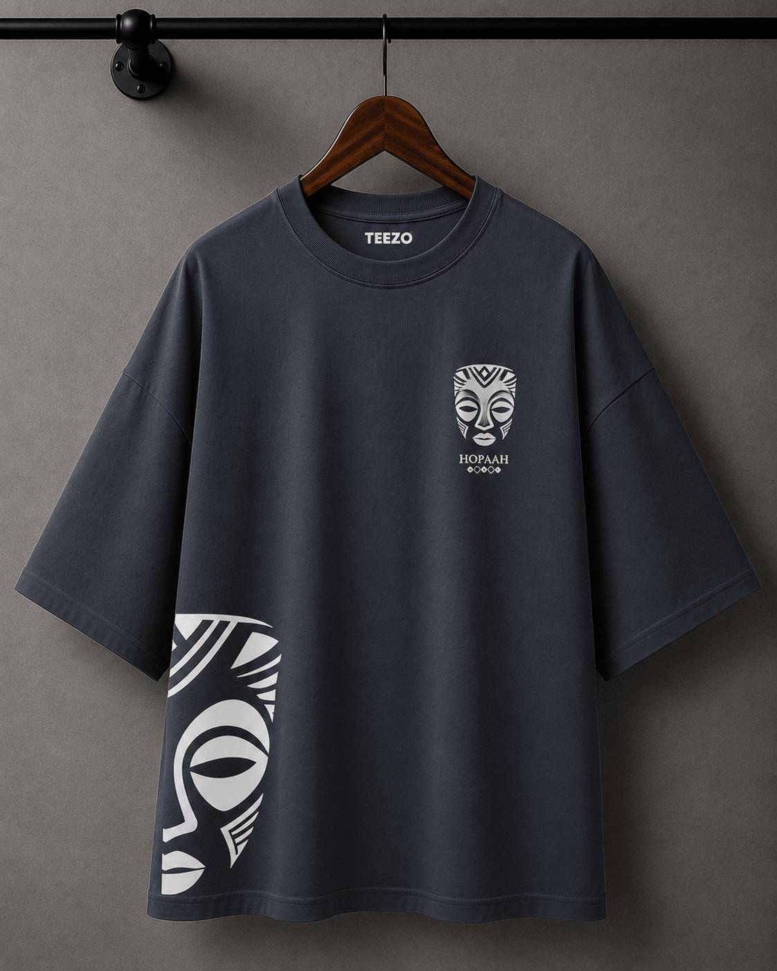Premium oversized cotton T-shirt featuring a black and white tribal mask graphic for unisex streetwear.