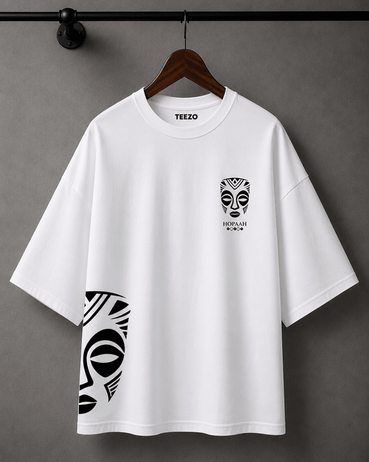 Premium oversized cotton T-shirt featuring a black and white tribal mask graphic for unisex streetwear.