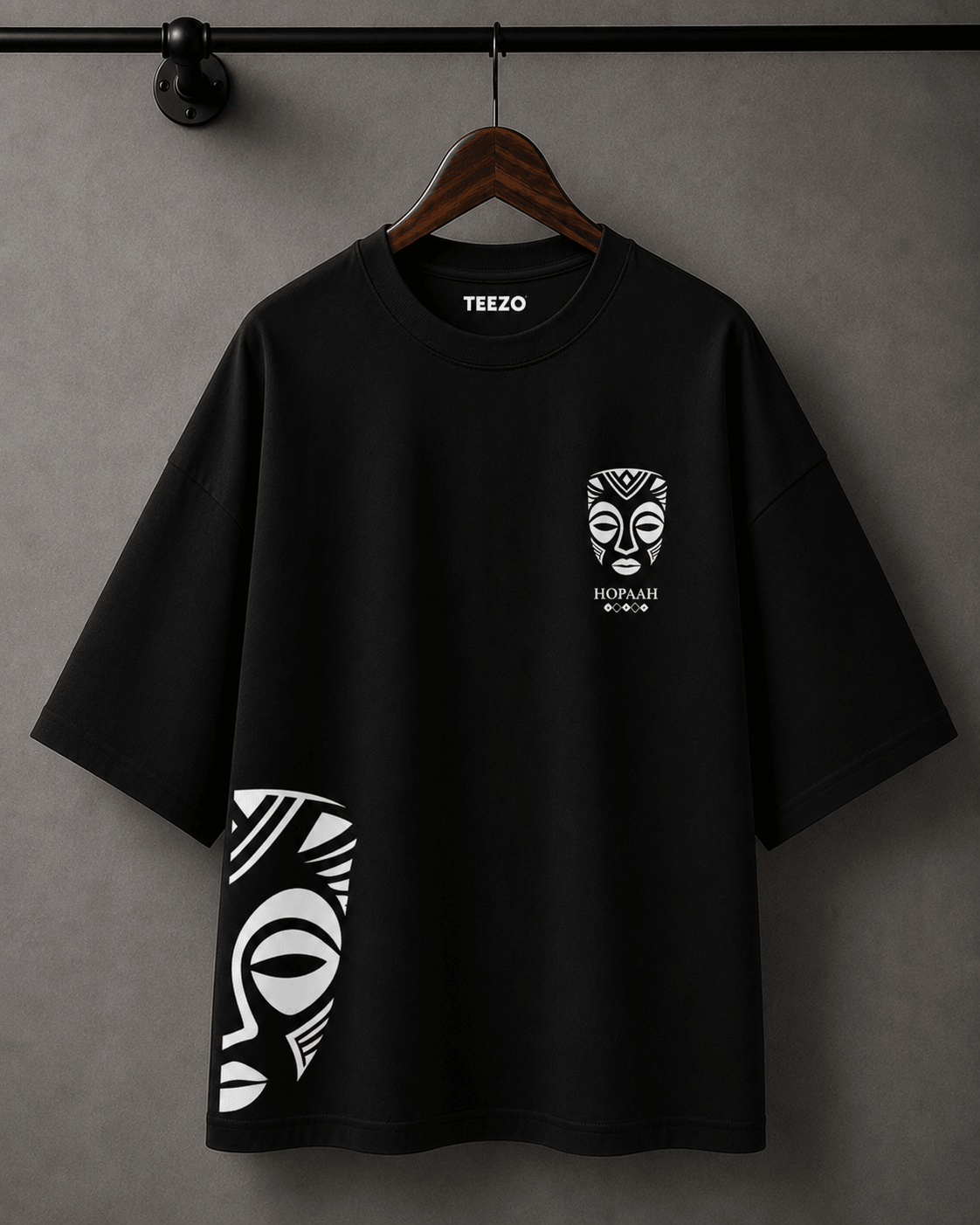 Premium oversized cotton T-shirt featuring a black and white tribal mask graphic for unisex streetwear.